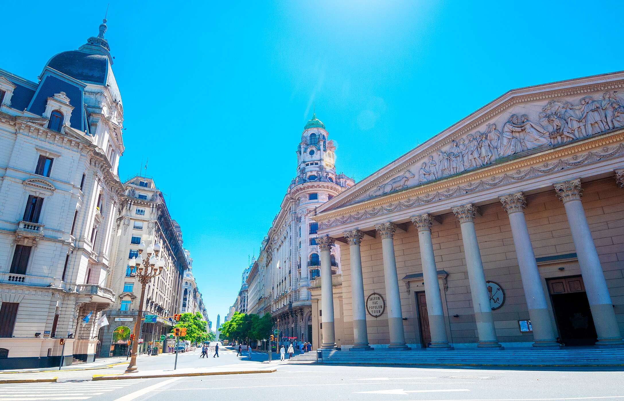 Facade of the imposing Metropolitan Cathedral of Buenos Aires, located on a city street with people strolling in the background