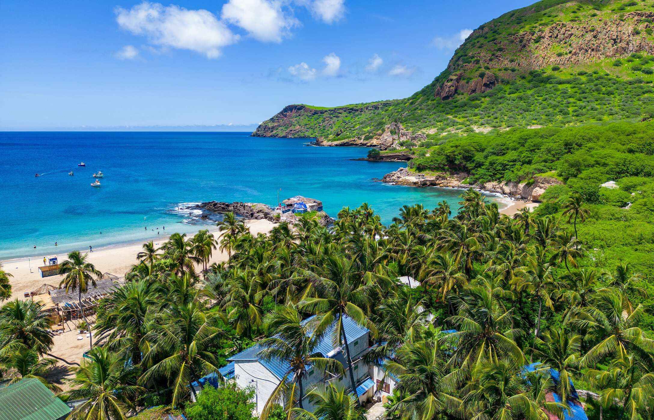 Tarrafal Beach, with its palm trees and crystal-clear waters, is an unmissable destination in Cape Verde