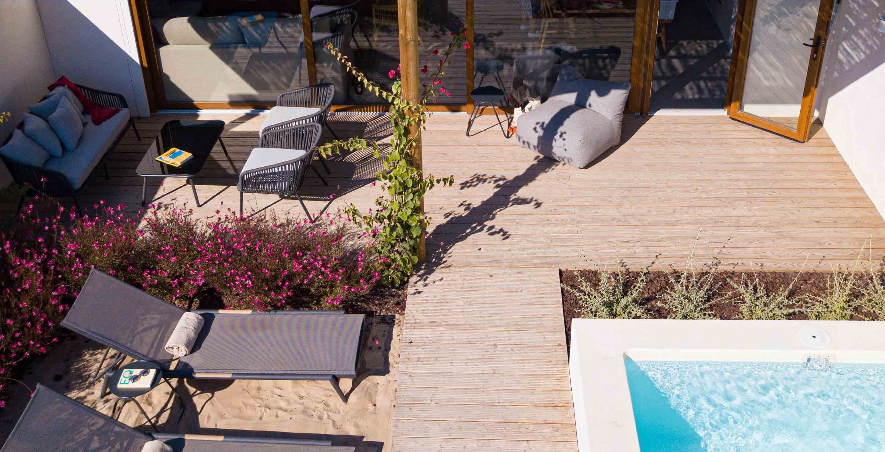 The Standard Villa at Pestana Comporta Village Residences has a terrace with a pool, sun loungers, and plants