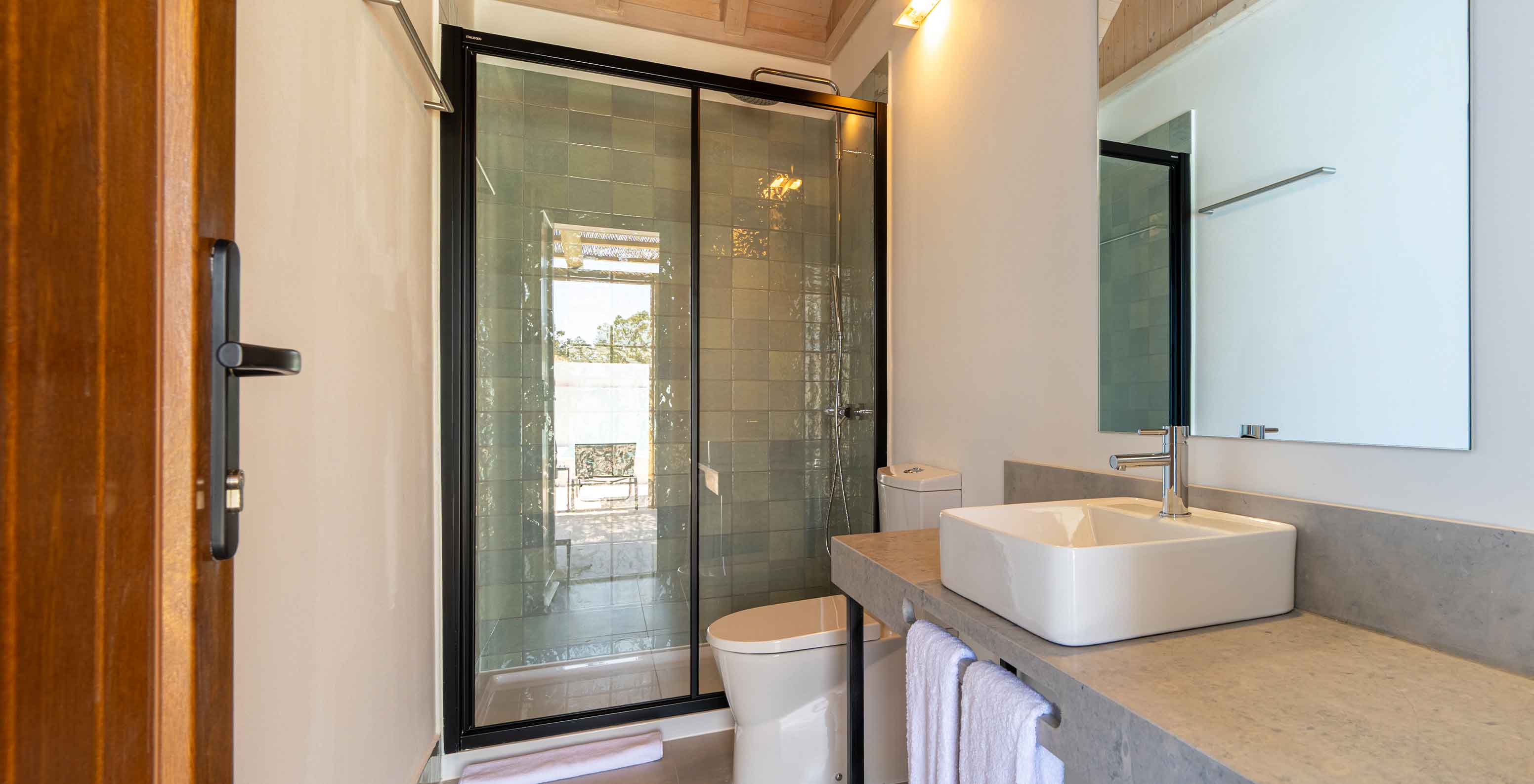 The Premium Green Villa at Pestana Comporta Village Residences has a bathroom in gray tones with a shower