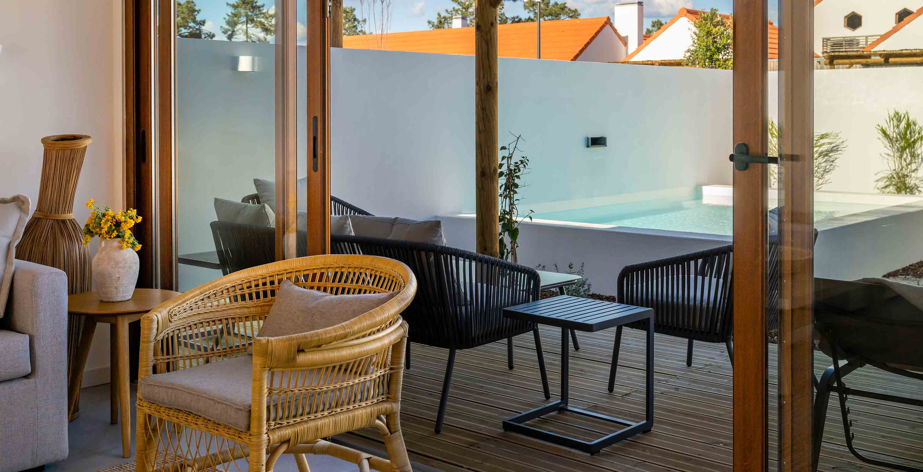 The Superior Villa at Pestana Comporta Village Residences has a terrace with a pool, chairs, and an outdoor table