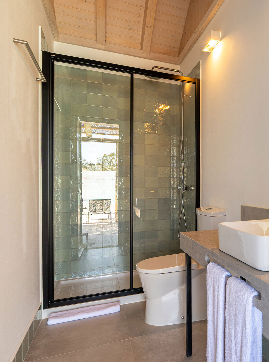 The Premium Green Villa at Pestana Comporta Village Residences has a bathroom in gray tones with a shower
