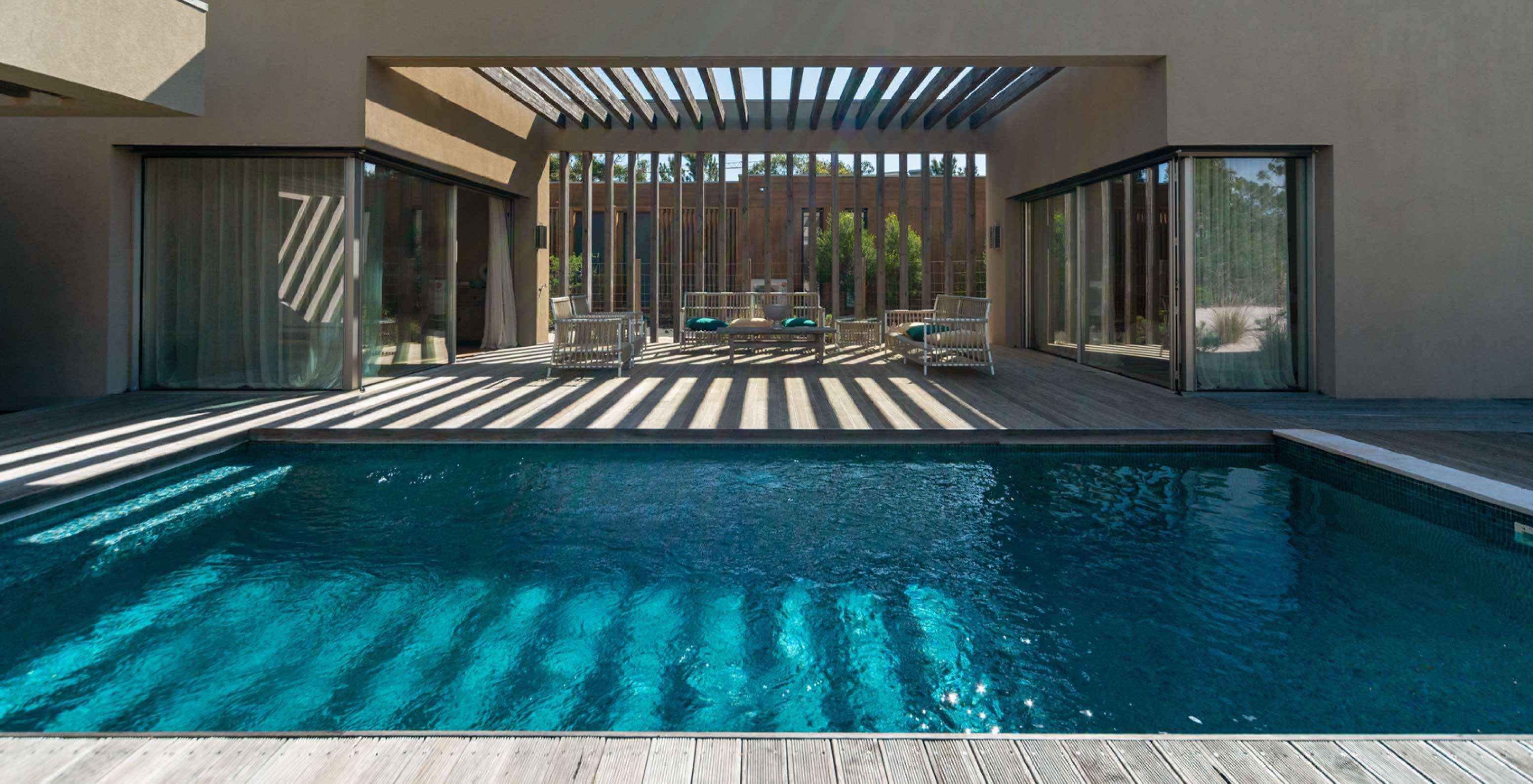 The exclusive villa with a pool at Pestana Tróia Eco Resort has an outdoor area with a terrace, a pool, and a seating area