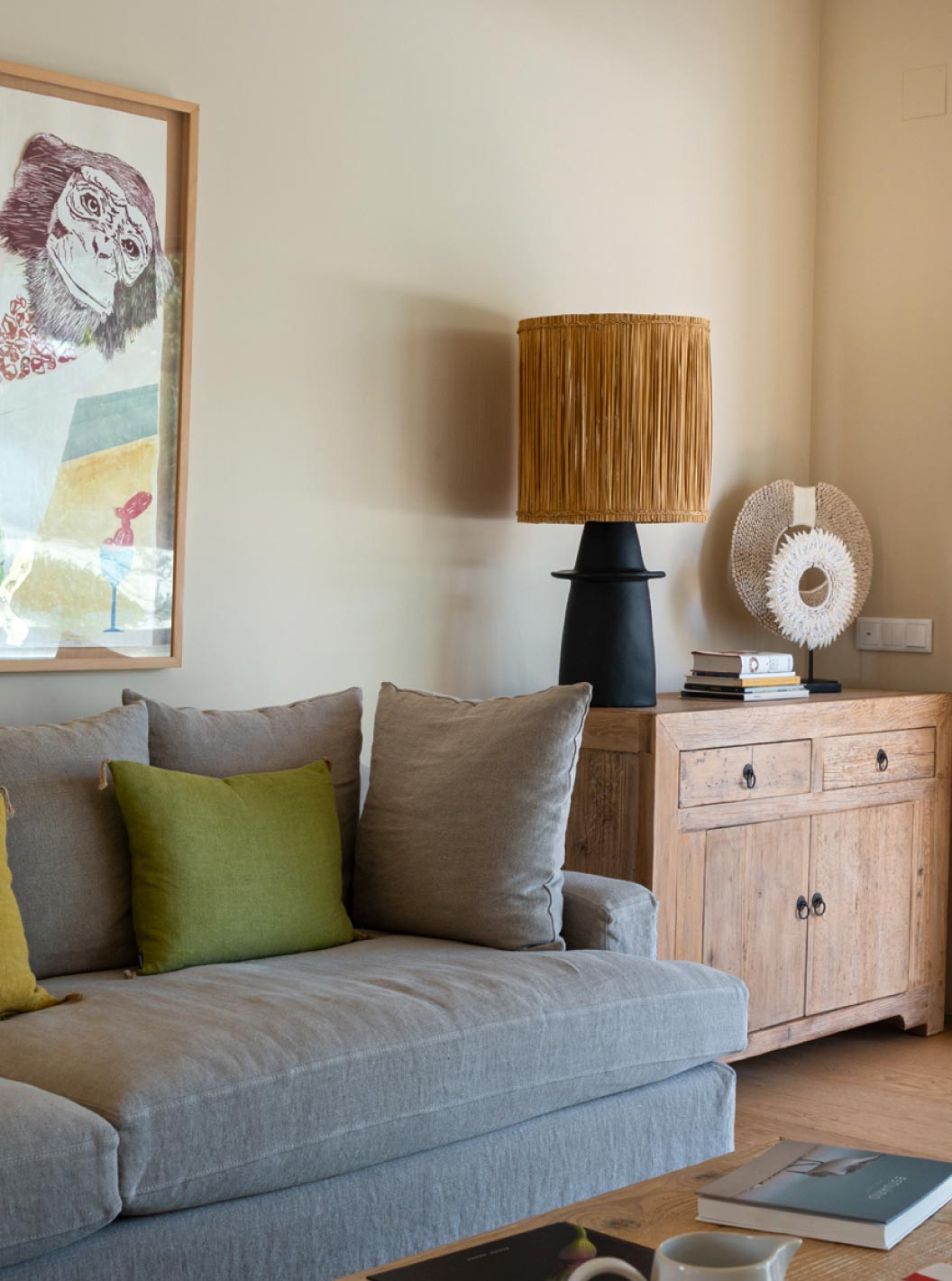 The exclusive villa with a pool at Pestana Tróia Eco Resort has a living room with a gray sofa and large window with curtains