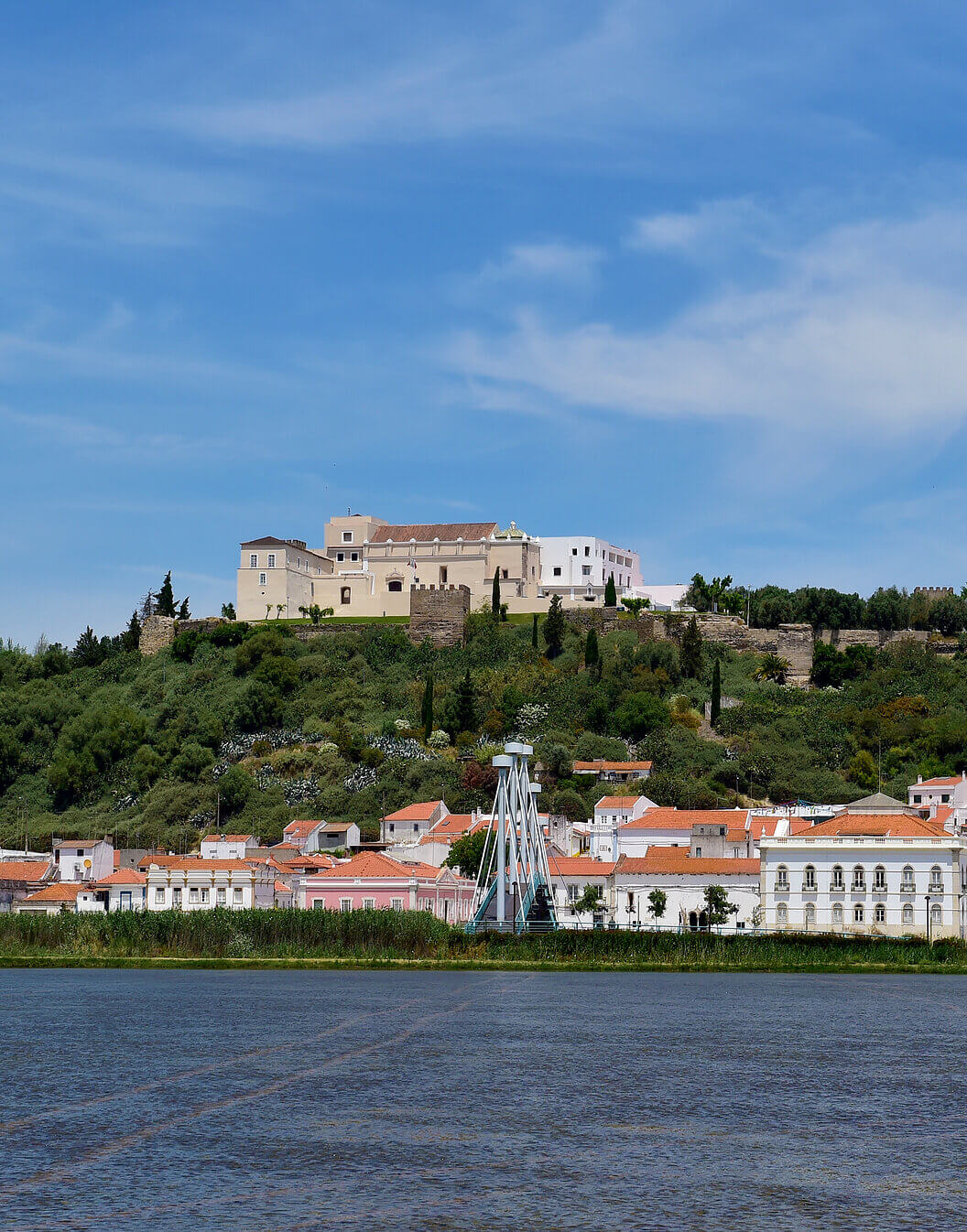 Exterior of Pousada Castelo Alcácer do Sal, a historic hotel in Alcácer do Sal, with surrounding vegetation