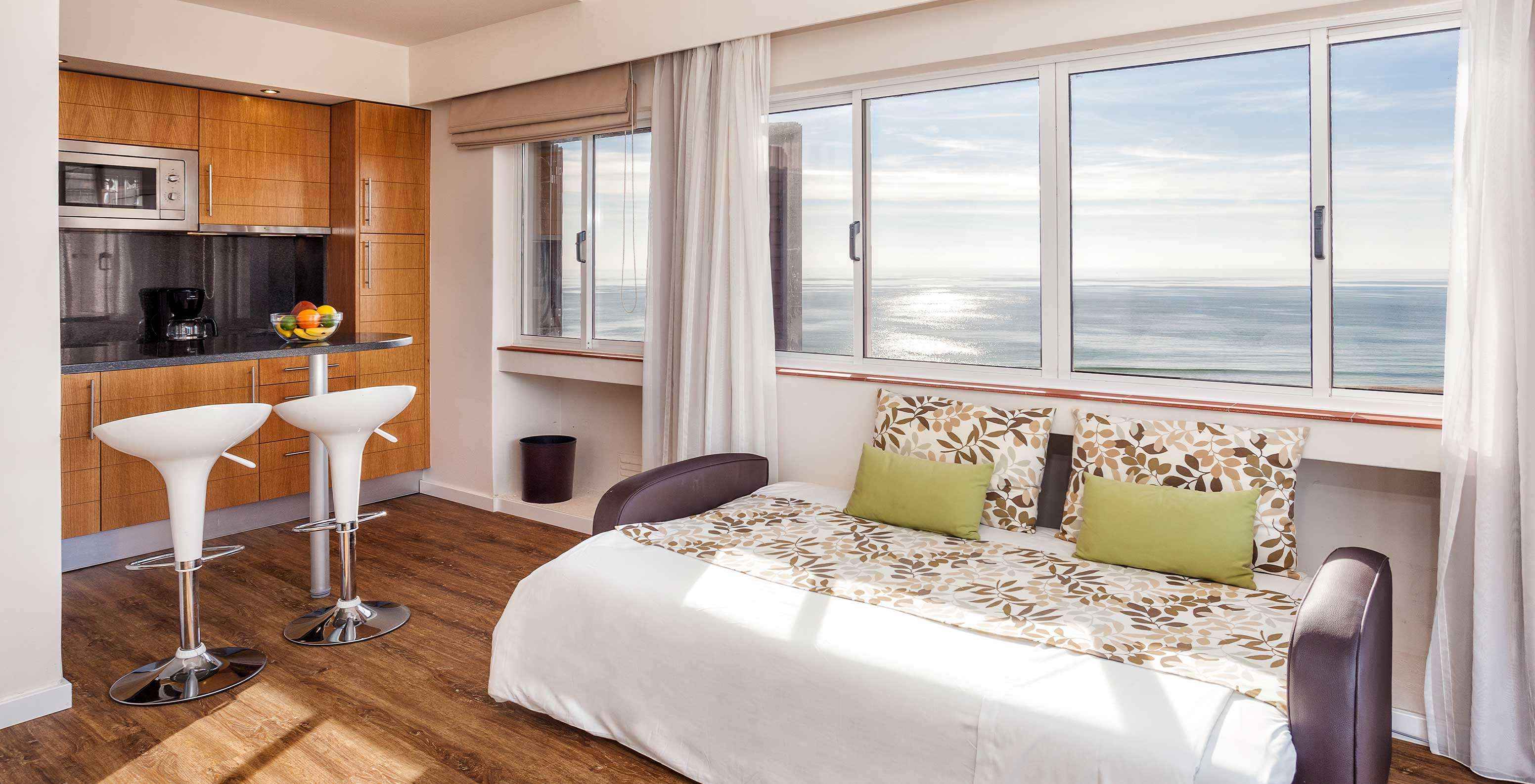 The Sea View Studio at Pestana Alvor Atlântico is equipped with a kitchenette with a sea view
