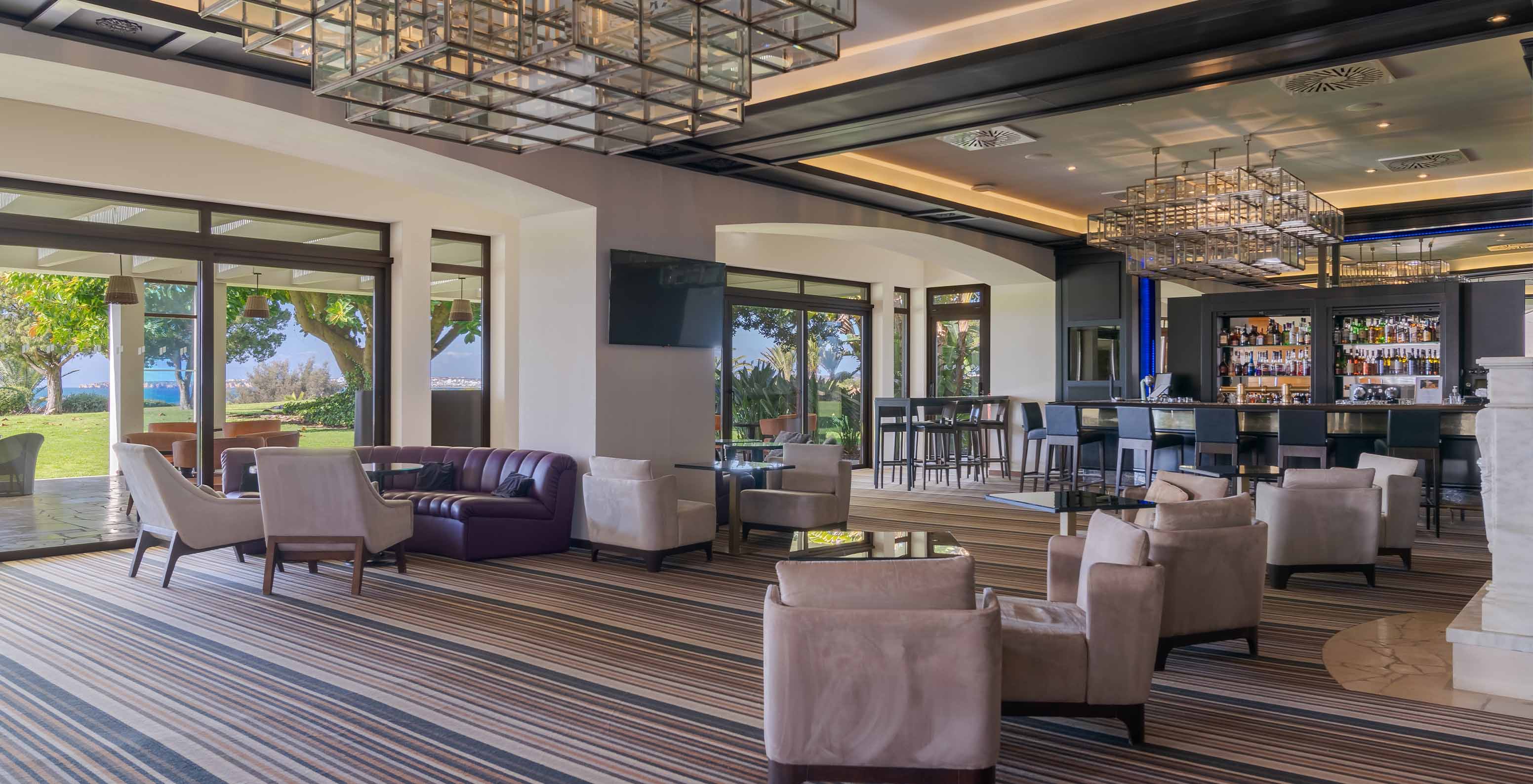 The D Henrique bar offers sofas and armchairs for drinks with views of the sea and garden