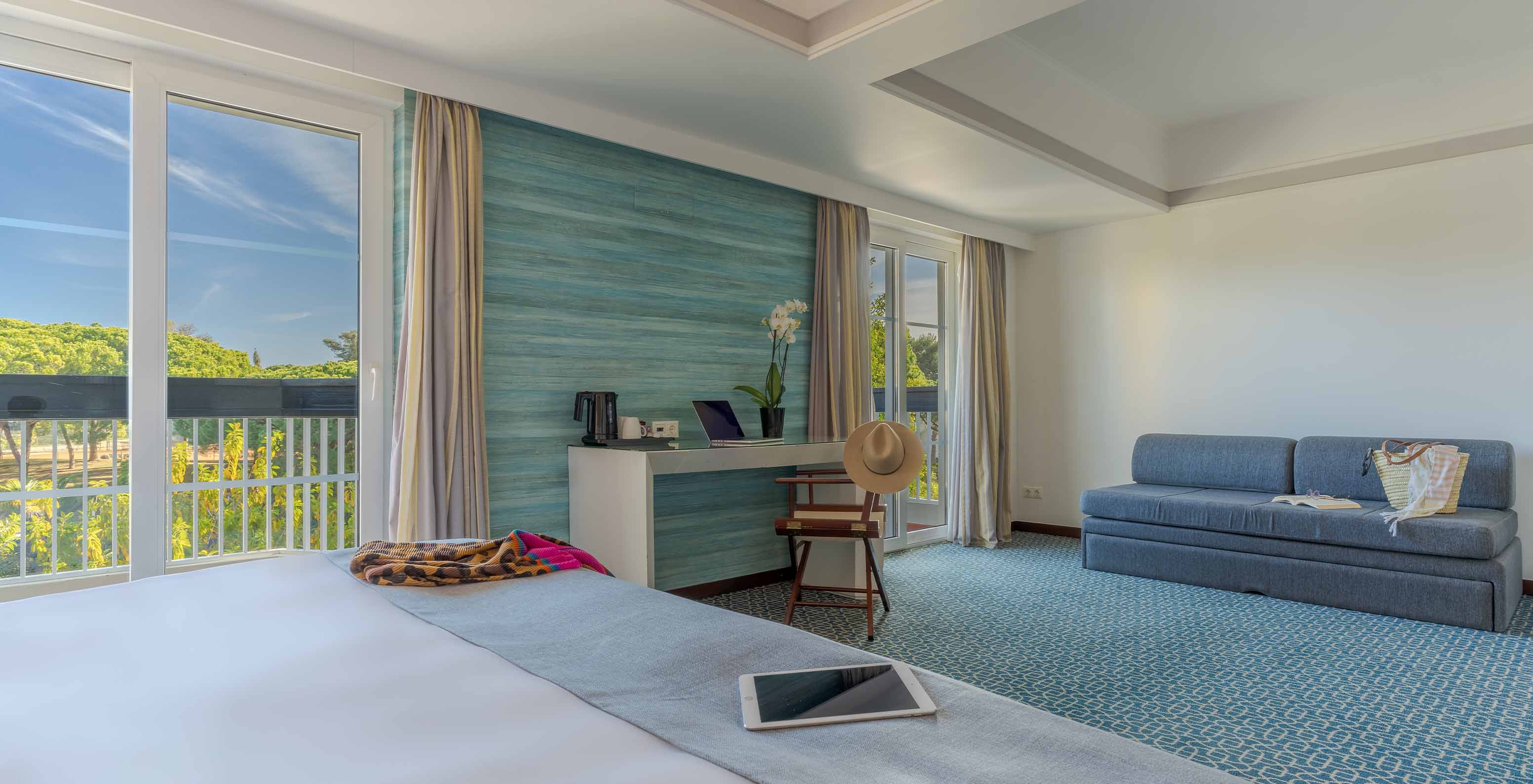 The Superior at Pestana Alvor Praia has a double bed, a sofa bed, and a large window desk with garden views