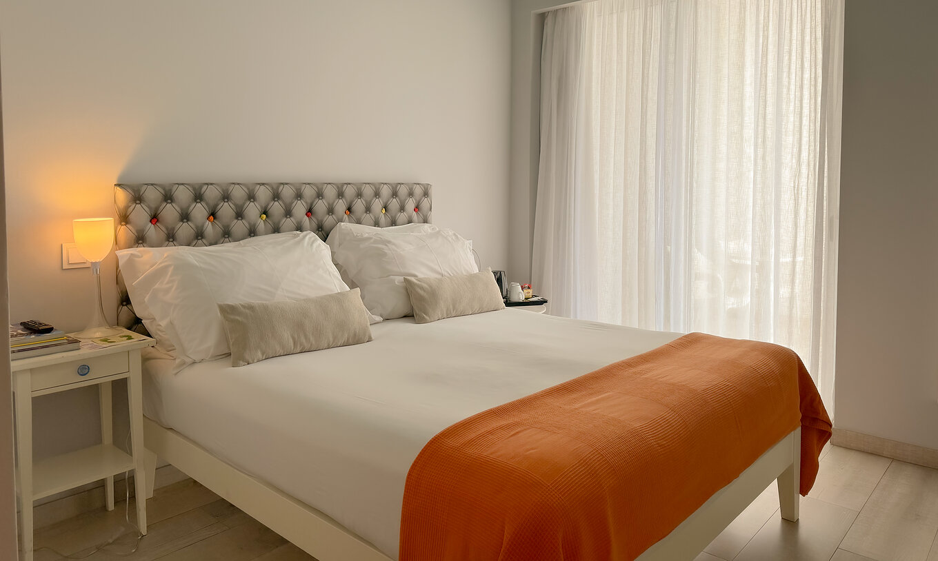 The Deluxe - Exclusive Website of Pestana Alvor South Beach has a double bed with a balcony or terrace with land view