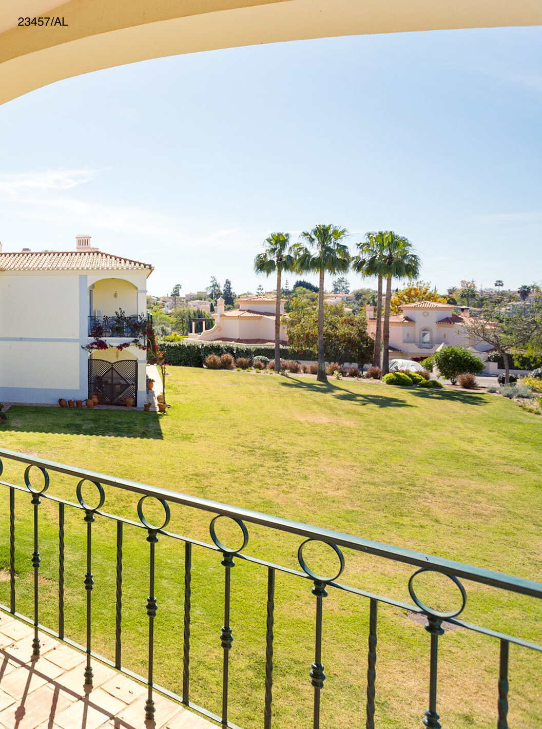 The Pestana Carvoeiro Golf T3 Standard Apartment has a balcony with a table, chairs, and garden views
