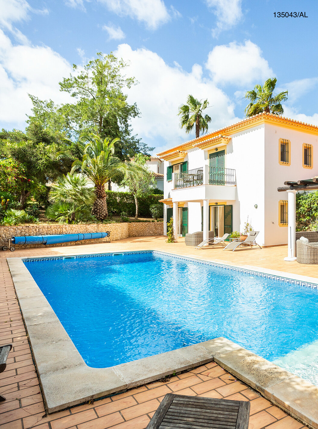 The Pestana Carvoeiro Golf V4 Standard Villa has an exterior patio with a pool and trees around it