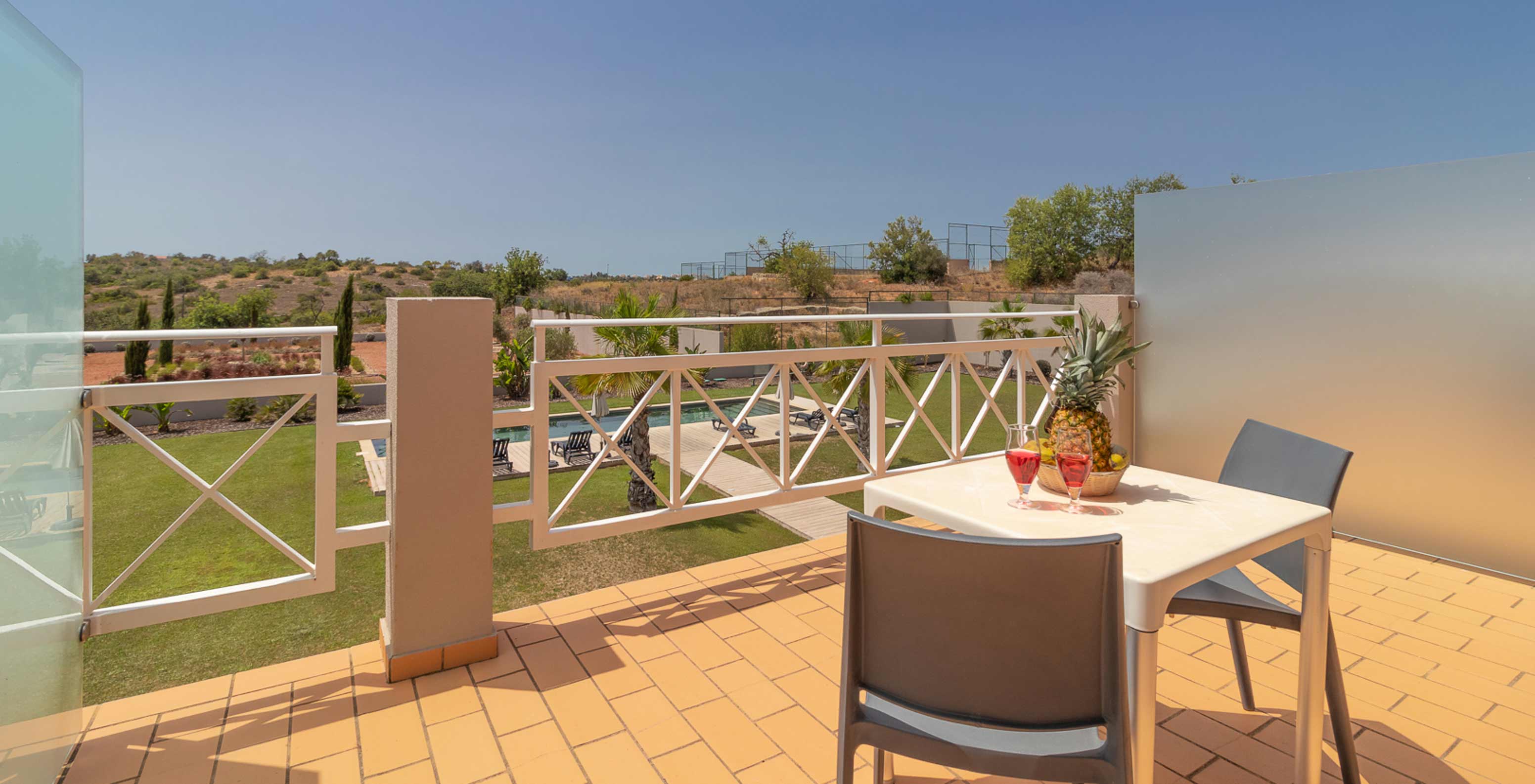 Classic Room with balcony, pool and garden view at Pestana Gramacho Residences