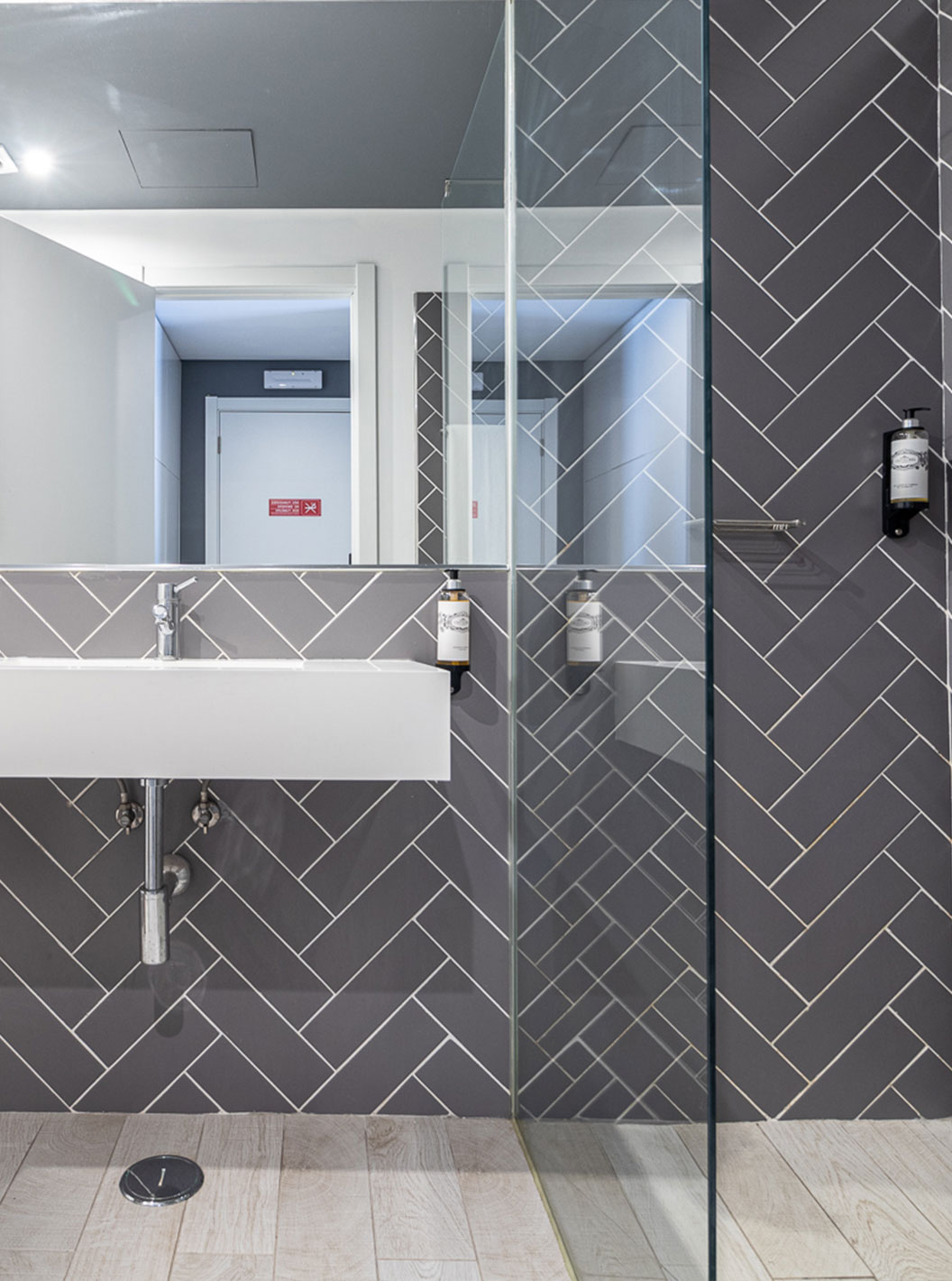 Classic Room at Pestana Gramacho Residences has a modern bathroom with white sink, mirror and glass shower