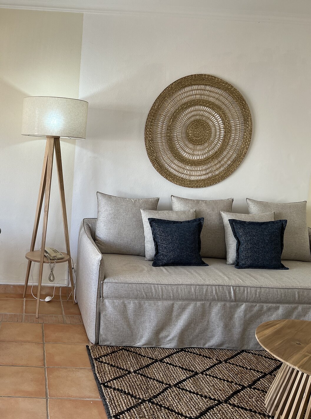 The T1 Apartment Standard do Pestana Palm Gardens has a living room with a sofa and cushions and a round table