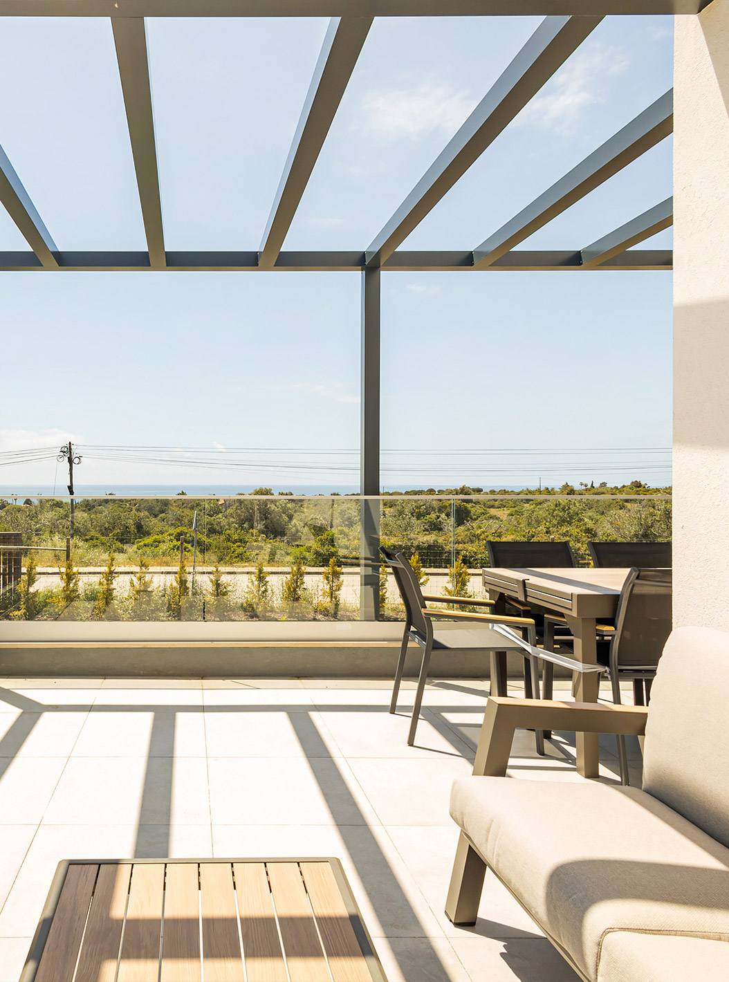 The First Floor 3 Bedroom Apartment - 5 Adults at Pestana Valley Nature Village has a terrace with sofas and a dining table