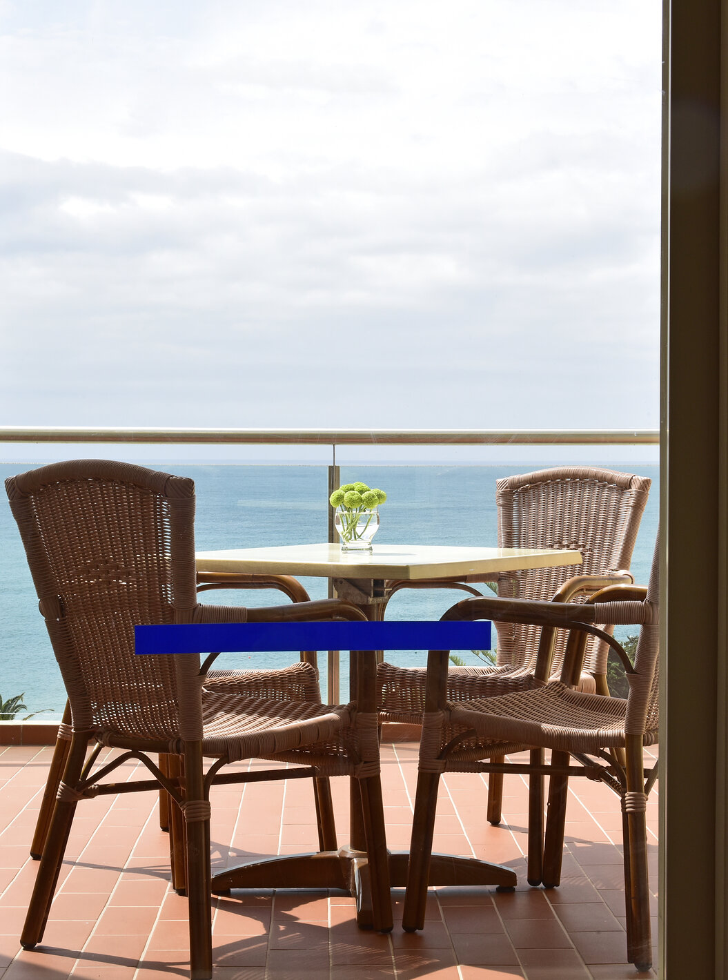 The Deluxe Sea View at Pestana Viking has a balcony with sea view, table and chairs
