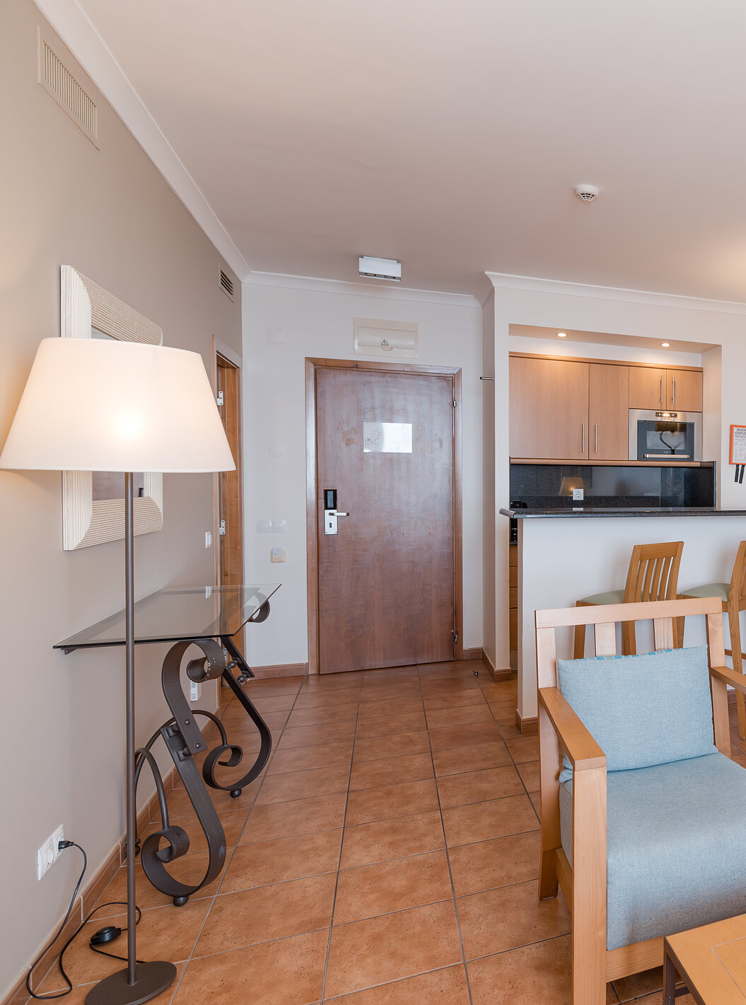 The Sea View Suite at Pestana Viking has a living room with sofa, armchairs and small kitchen with microwave