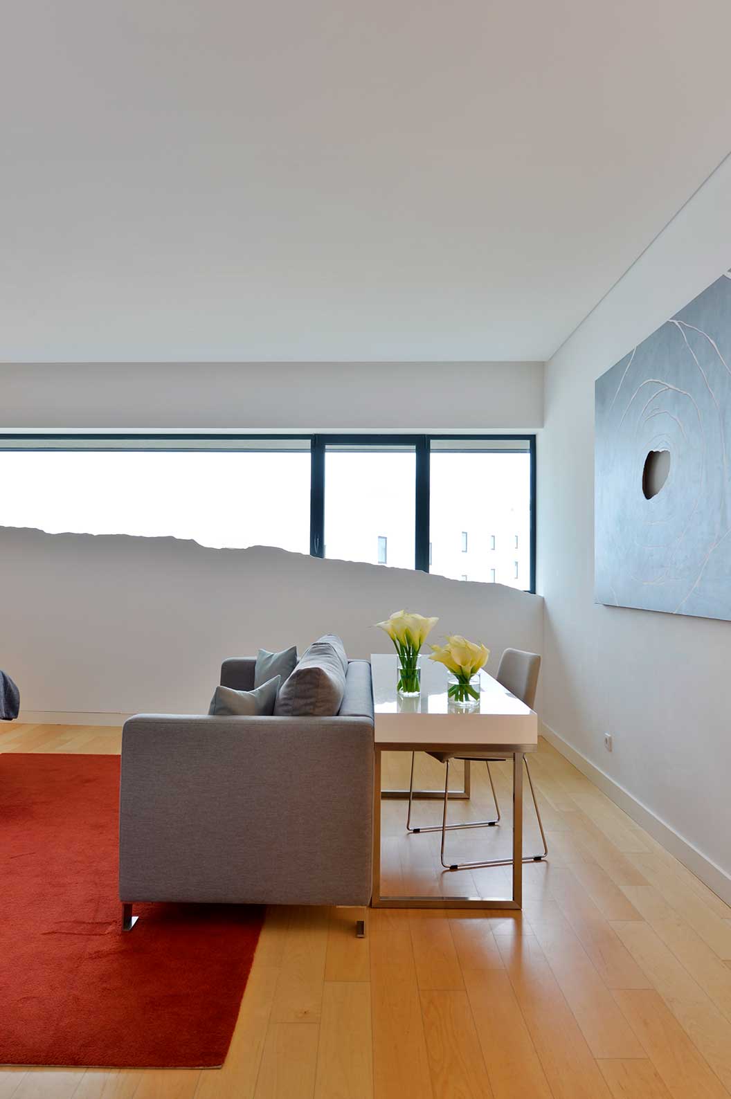 The Superior Double Room at Pestana Cidadela Cascais has a sofa, a desk with a chair, and a window with art