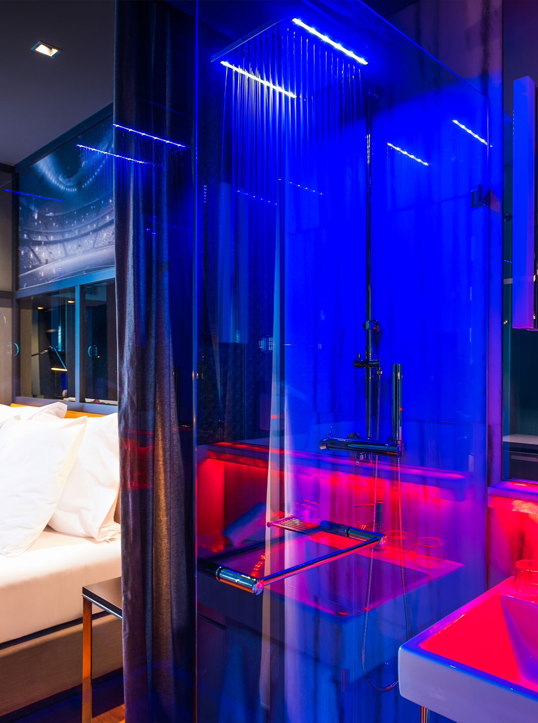 The CR7 Superior Room at Pestana CR7 Lisboa includes a double bed and shower with LED lights