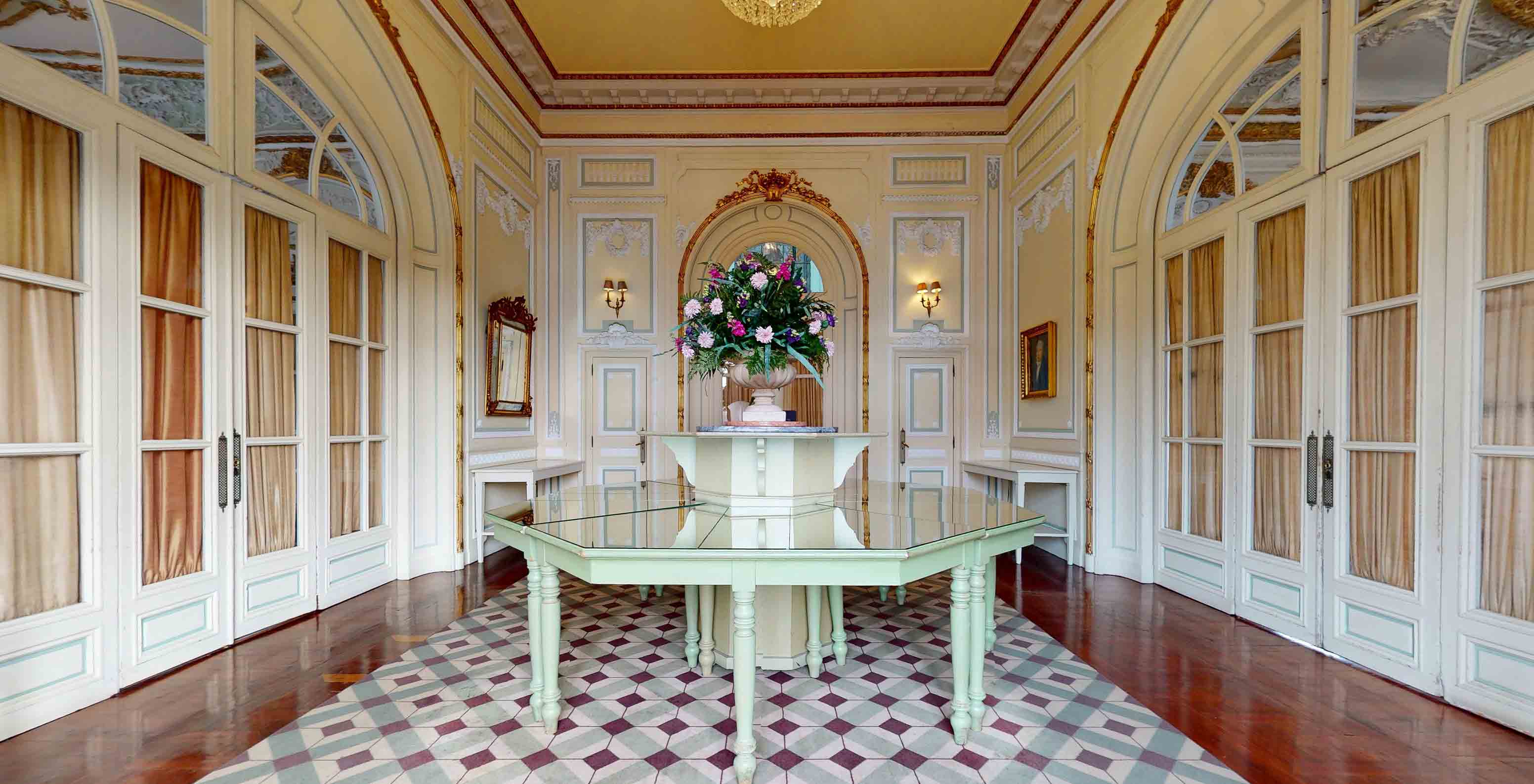 The Valle Flôr Restaurant at the 5-star hotel, National Monument, has a central table with a vase of colorful flowers
