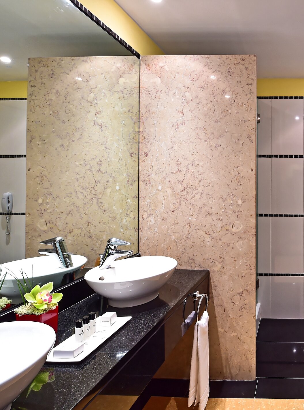The Junior Suite of Pestana Sintra Golf has a bathroom with two sinks with mirrors, amenities, and a bathtub