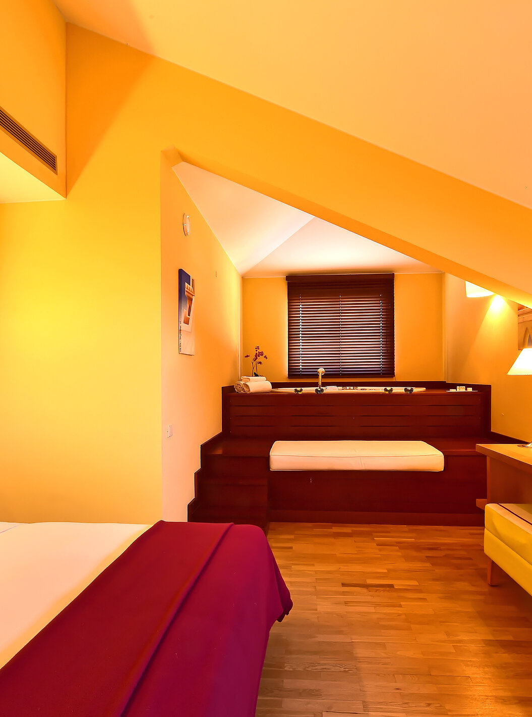 The Mezzanine Jacuzzi Suite of Pestana Sintra Golf has a double bed, jacuzzi in the room and a television in front of the bed