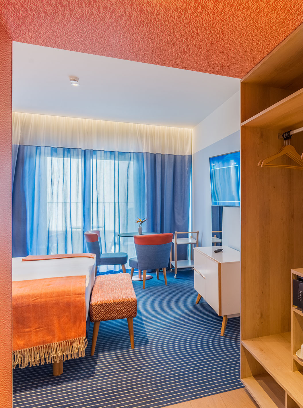 The Sea View Deluxe Studio at Pestana Casino Studios has a kitchen with a microwave and sink and a double bed