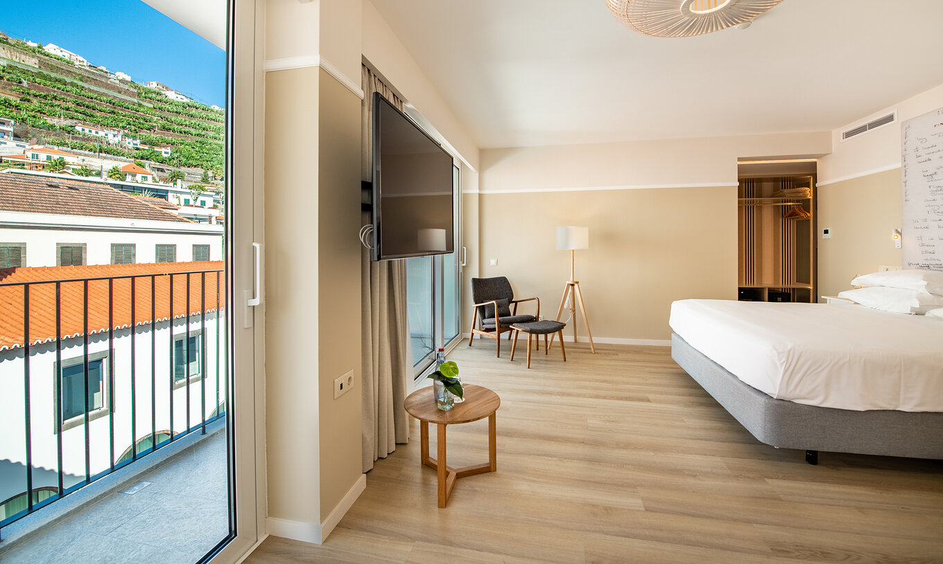 The Superior Family room at Pestana Fisherman Village has a spacious area and a large balcony with a city view