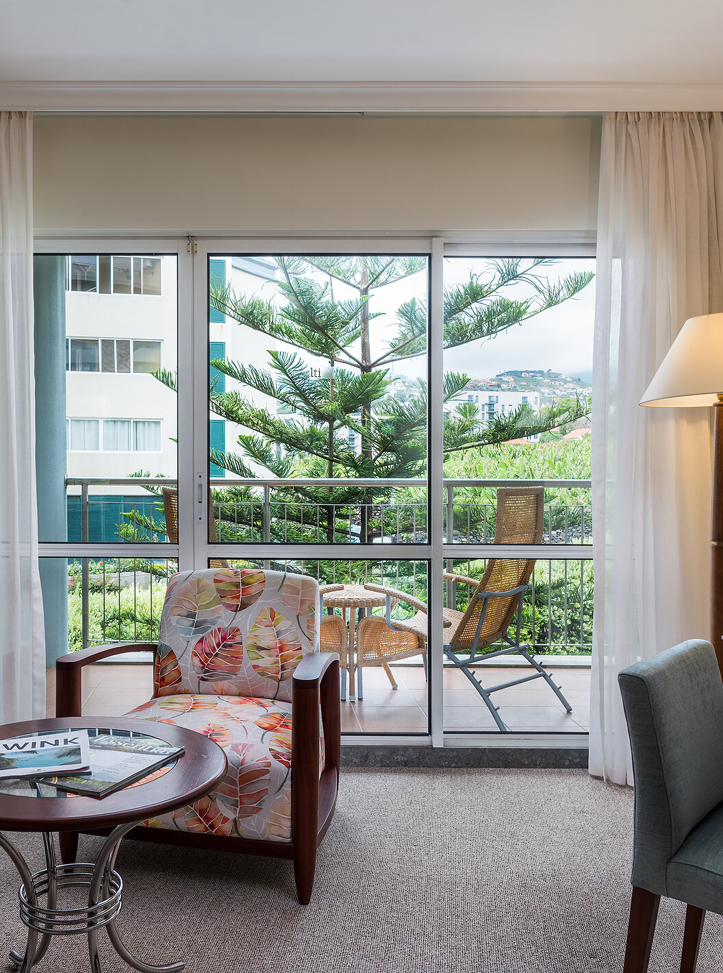 The Classic Inland View Room at Pestana Grand has a sofa, armchair and a desk