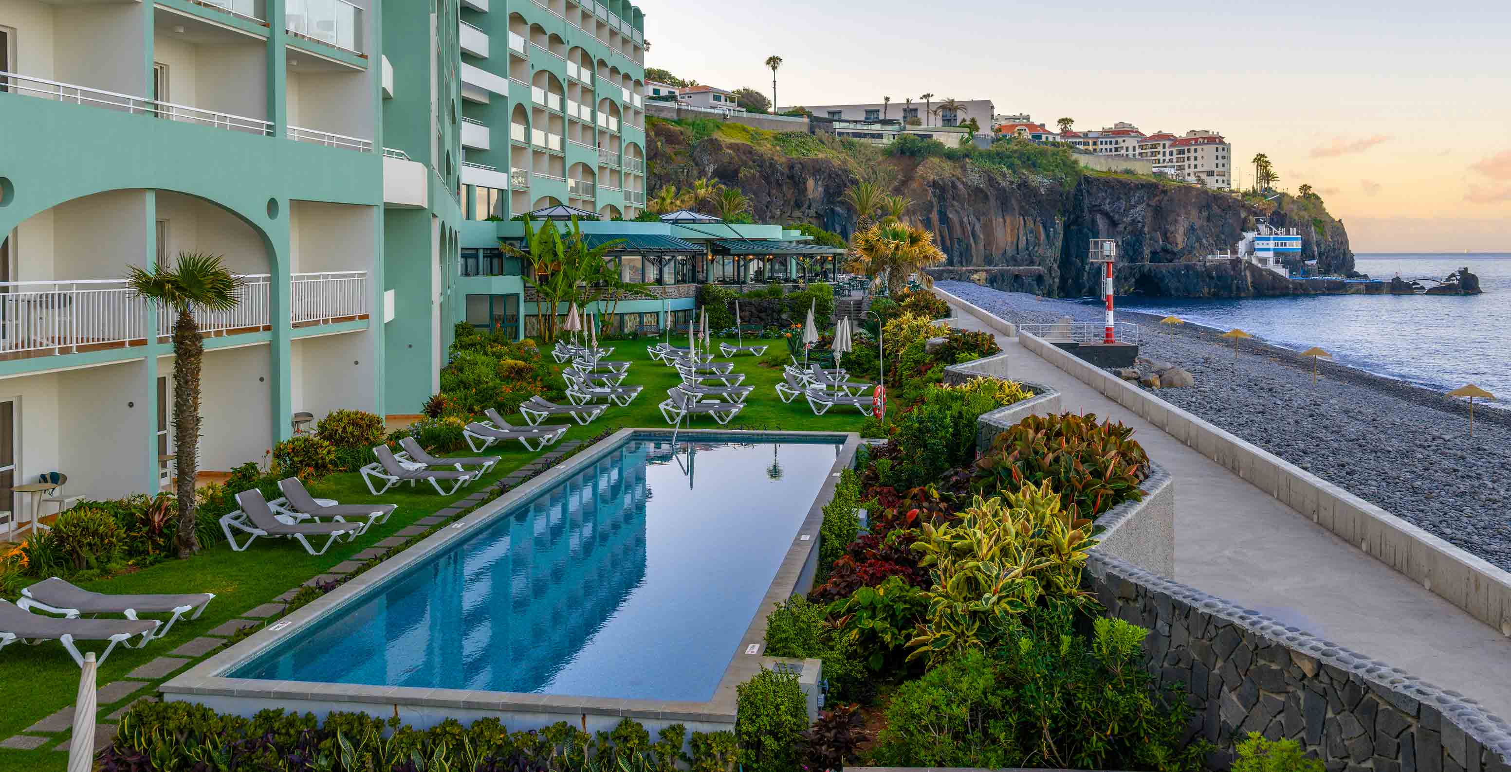 Exterior facade of Pestana Ocean Bay All Inclusive, a 5-star hotel in Funchal, Madeira, with pool