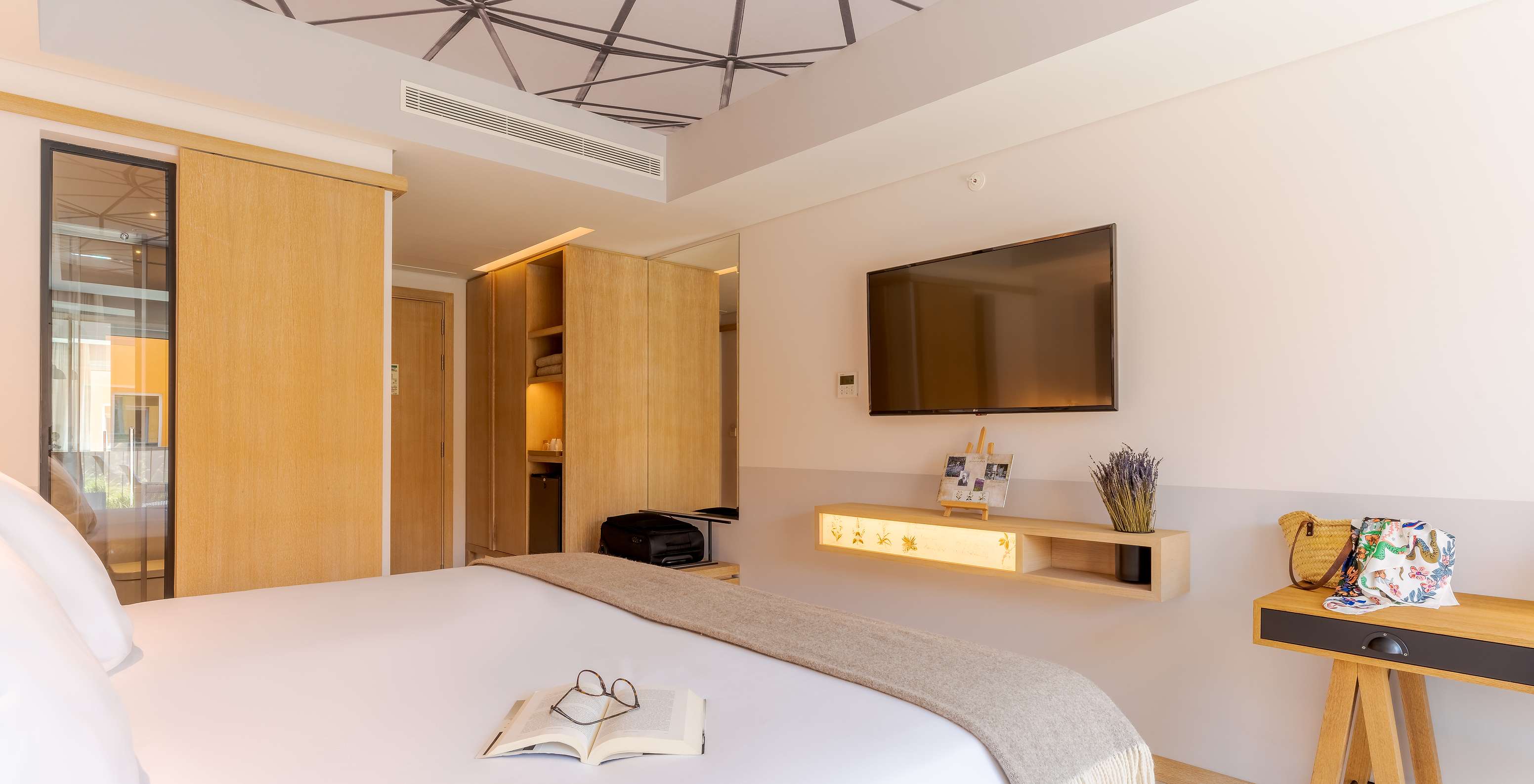 The Superior room at Pestana Douro Riverside includes a double bed, television, and wardrobe for clothes