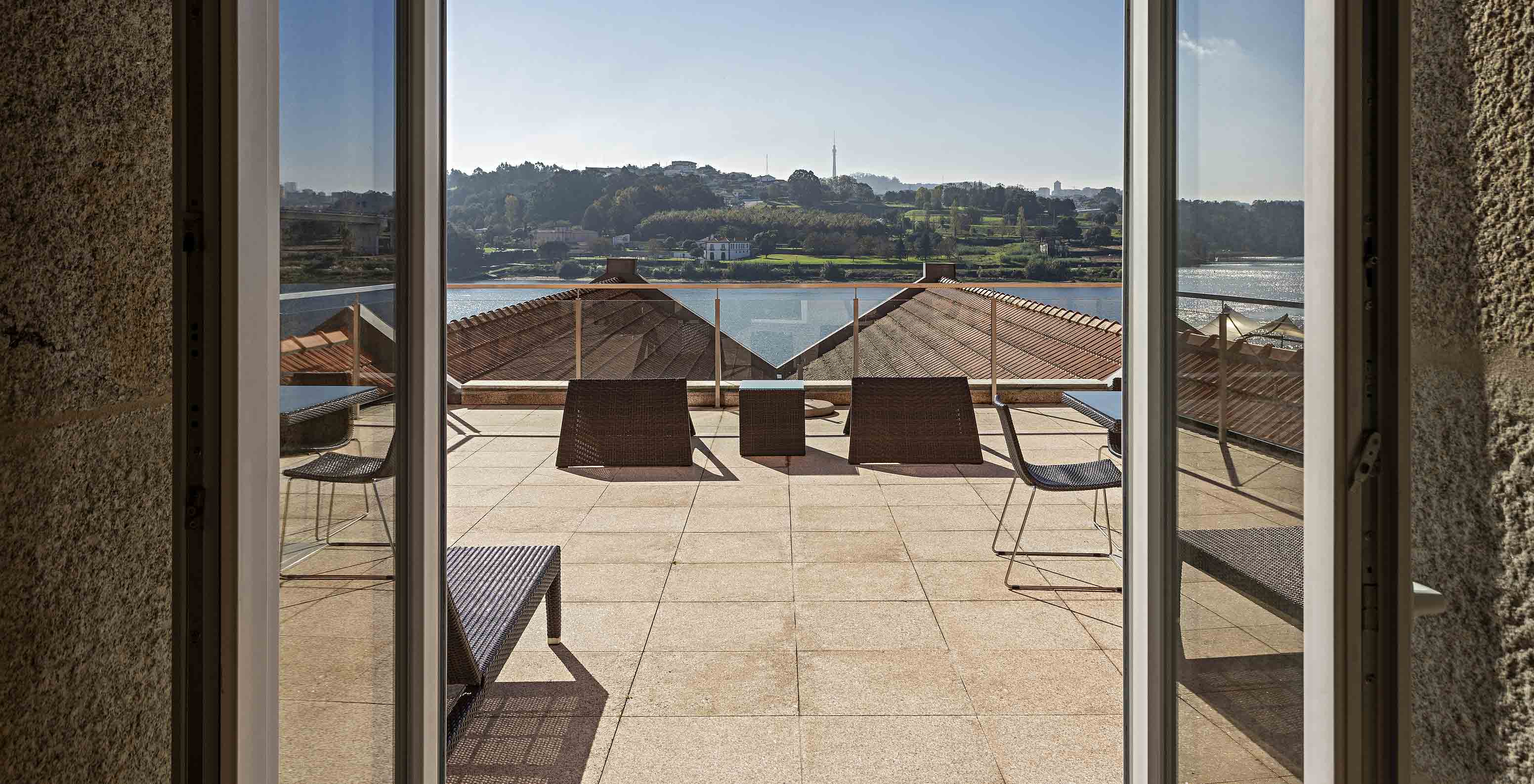 The Suite Nasoni has a large balcony with two tables, chairs, and a sun lounger