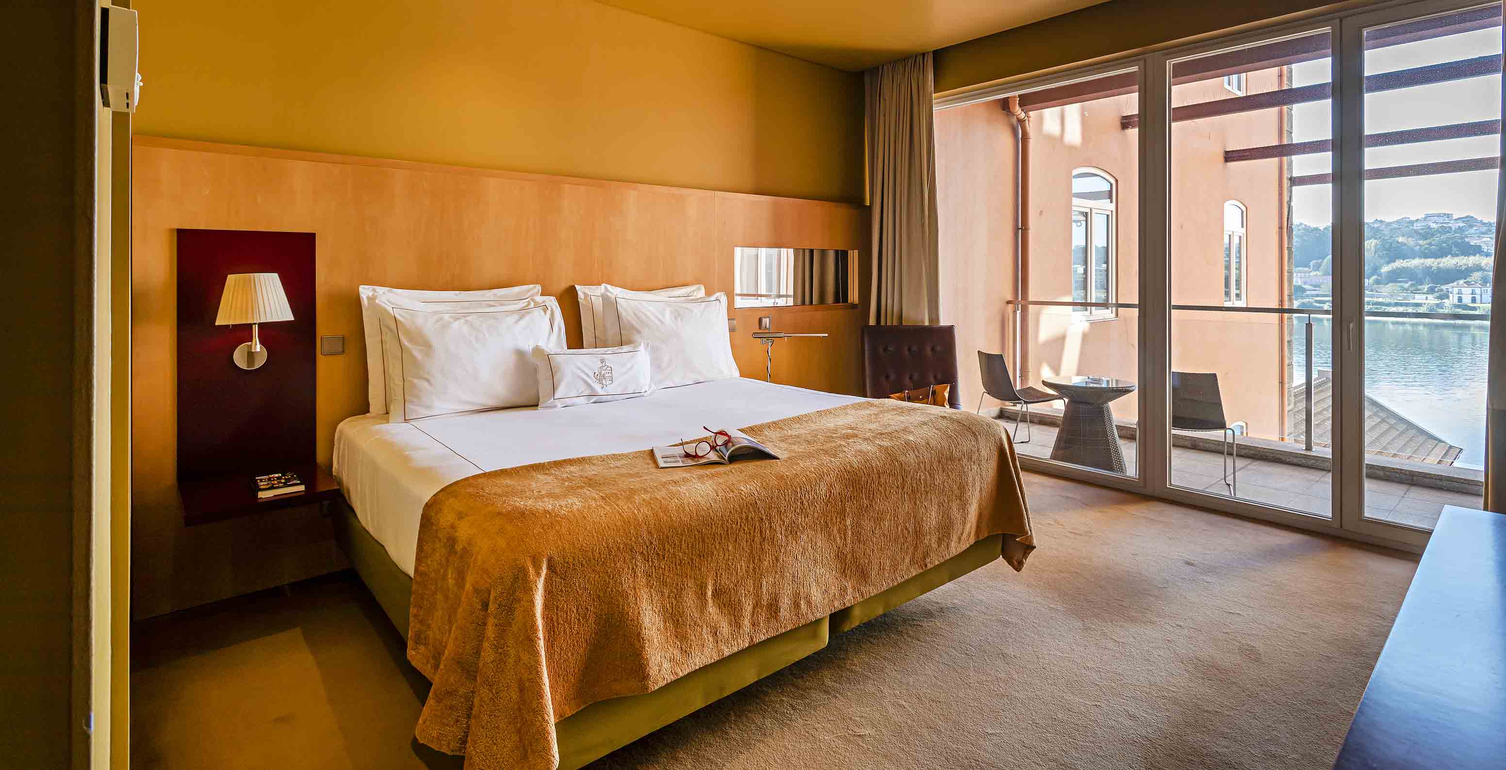 The Suite Balcony has a double bed and a window to the balcony with river view