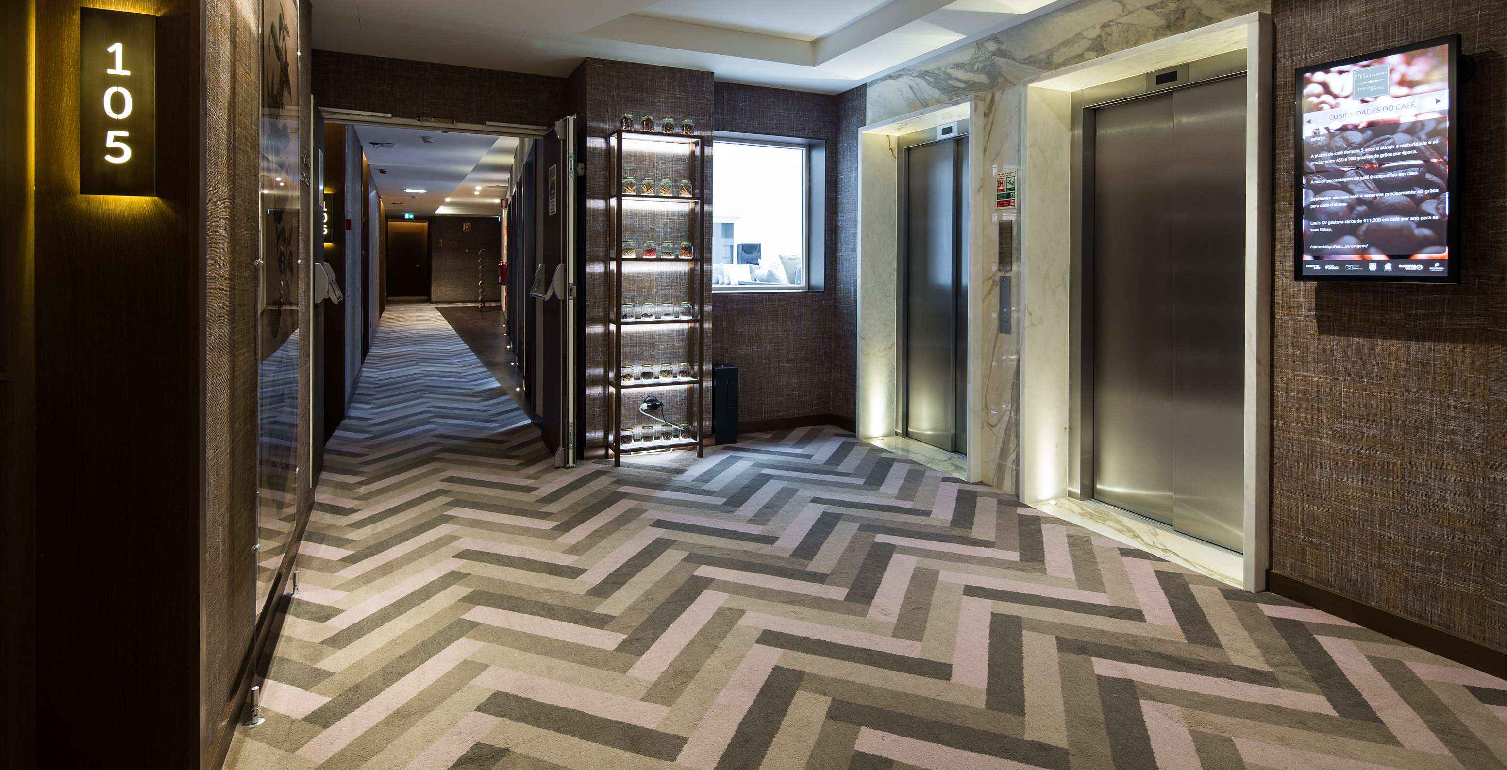 Hallways of Pestana Porto - A Brasileira featuring a piece of furniture displaying the themes of each floor