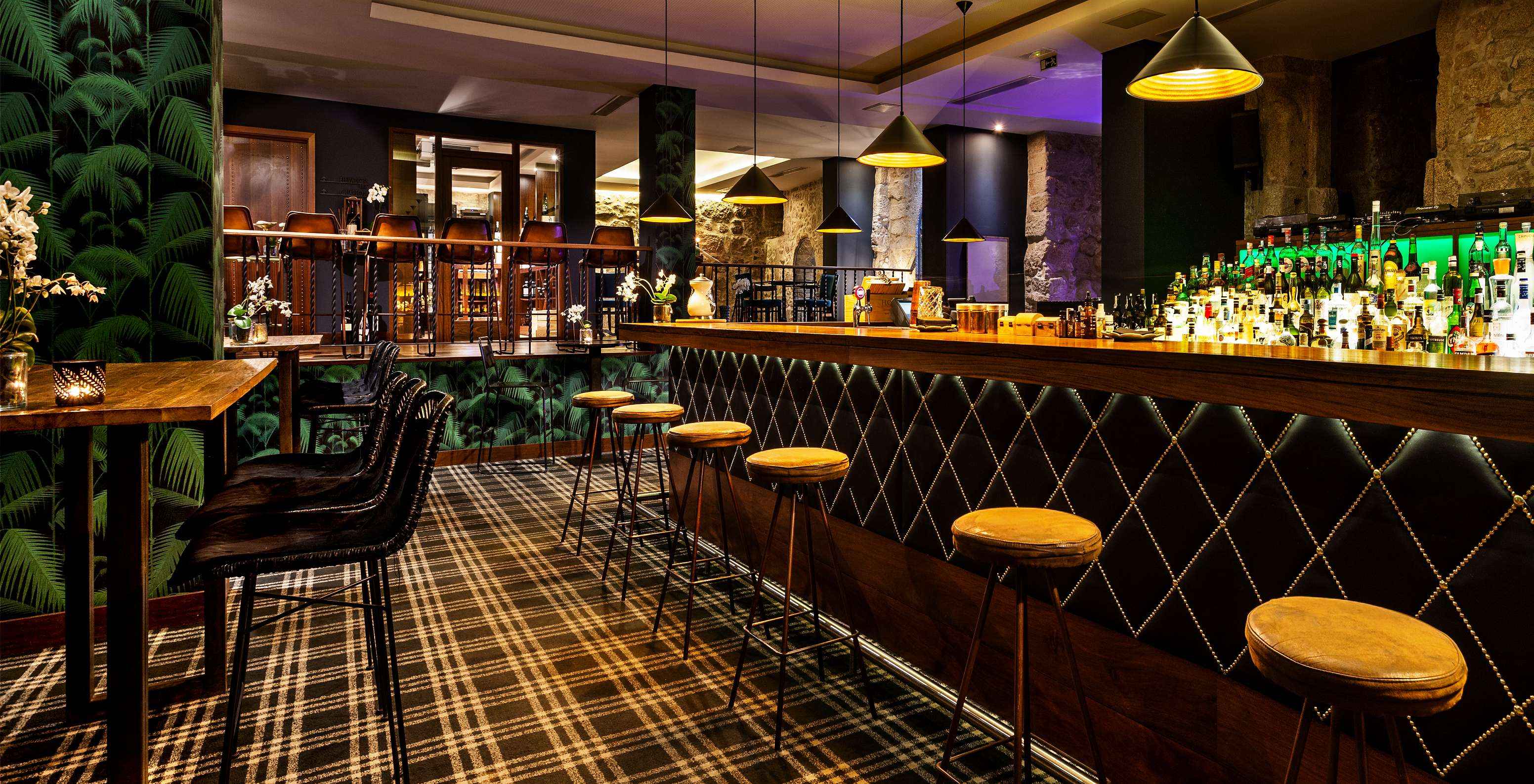 The Rib Bar at the 5-Star Hotel in downtown Porto has an elegant bar atmosphere with dark tones
