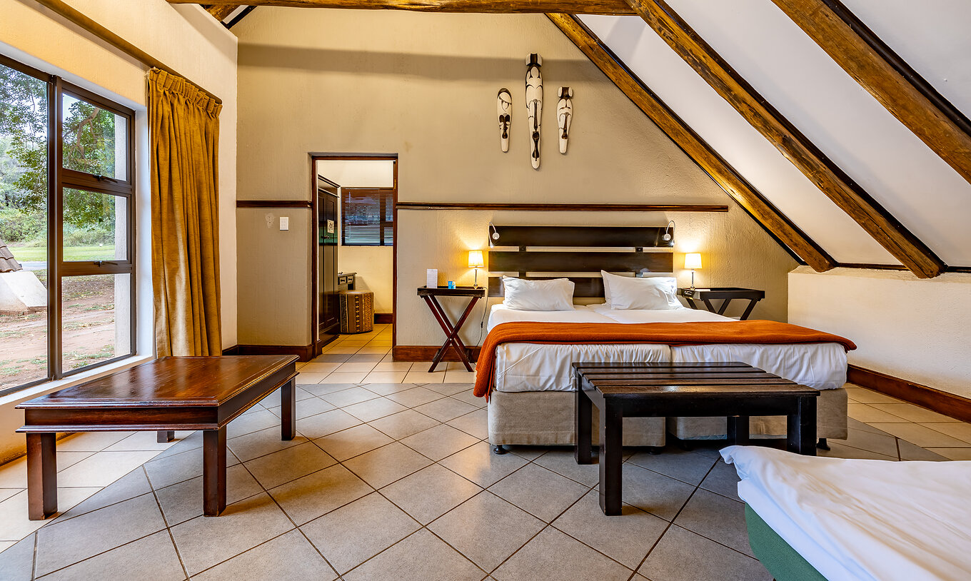 The Family Room at Pestana Kruger Lodge has a spacious room with window, two single beds and an extra bed