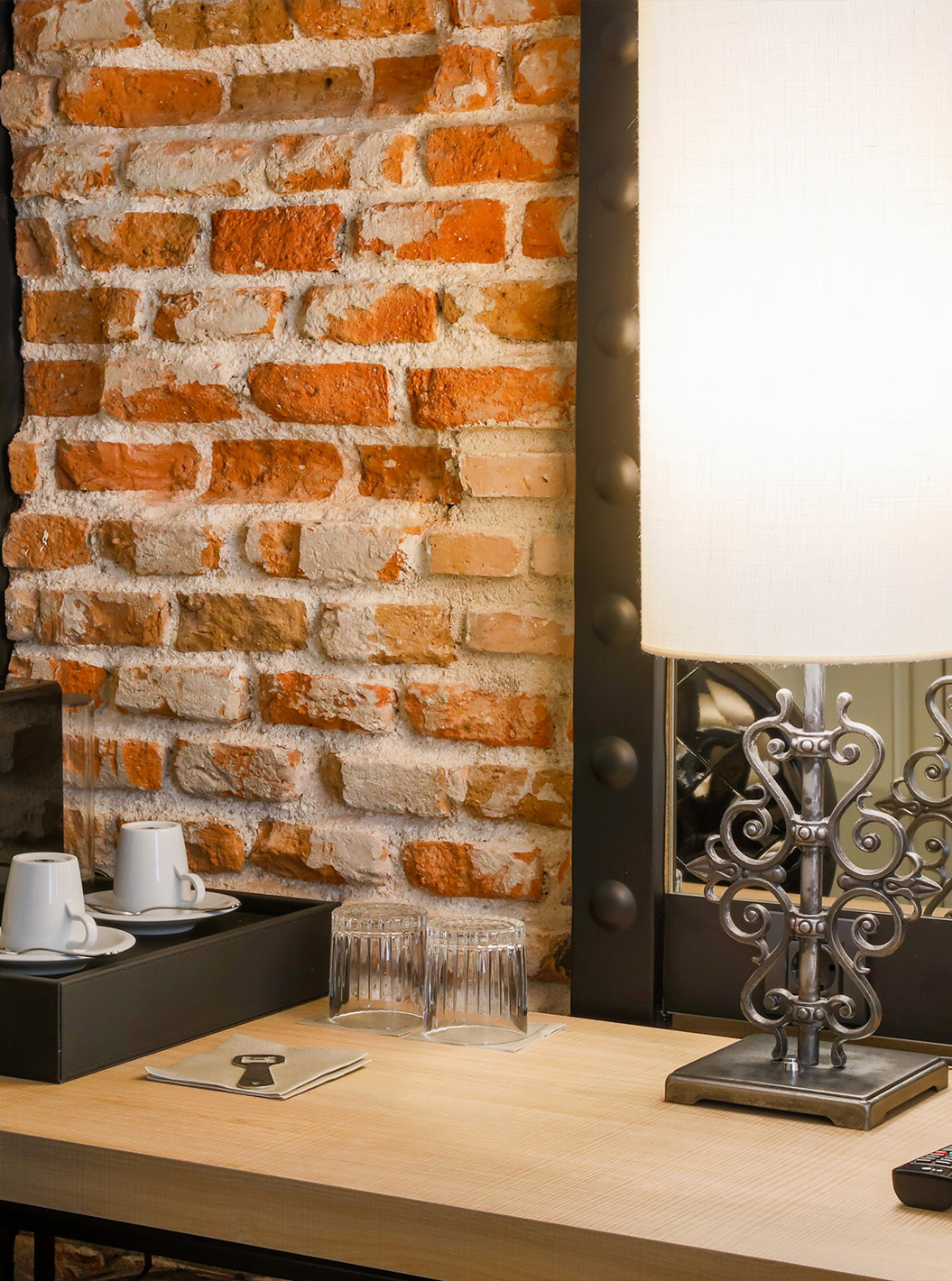 Superior Room at Pestana Plaza Mayor Madrid has a desk, a chair, a mirror and a Nespresso coffee machine