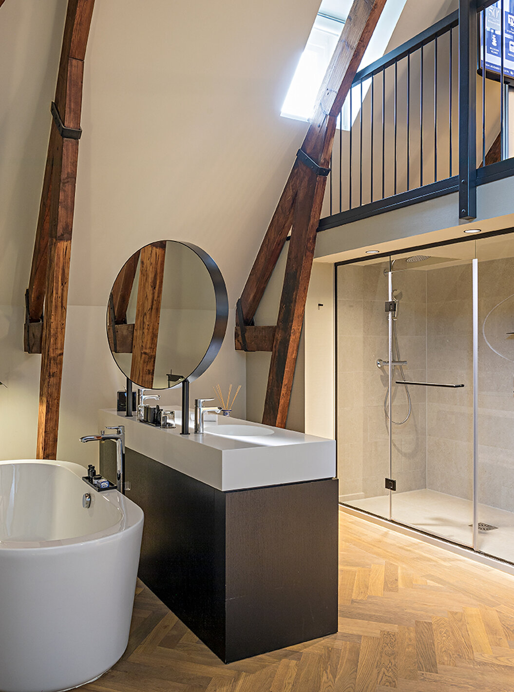 Clock Tower Suite at Pestana Amsterdam Riverside has a bathroom with two sinks, mirror and bathtub or shower