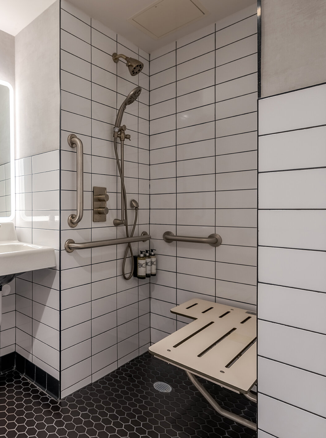 The Deluxe King Room ADA at Pestana CR7 Times Square has an adapted bathroom with sink and shower