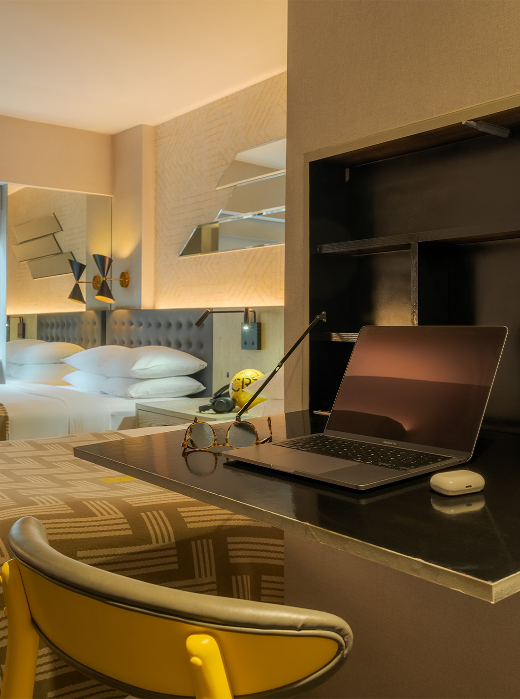 The Superior Double ADA at Pestana CR7 Times Square has a shelf for using a computer and a double bed