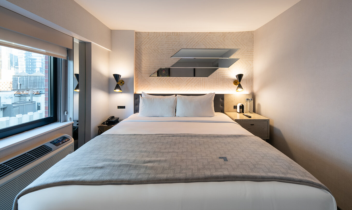 The Superior King High Floor ADA at Pestana CR7 Times Square has a double bed by the window