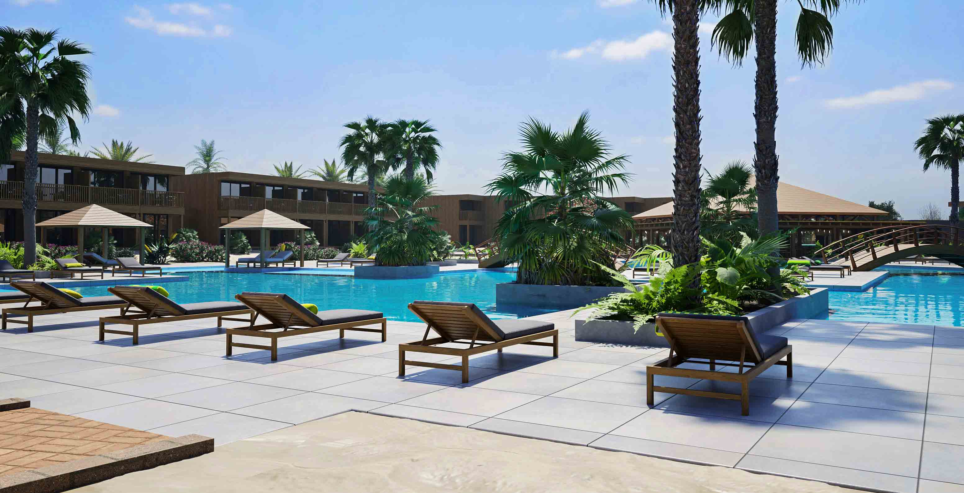 Piscina exterior do Pestana Dunas Porto Santo com espreguiçadeiras, palmeiras e ponte de madeira