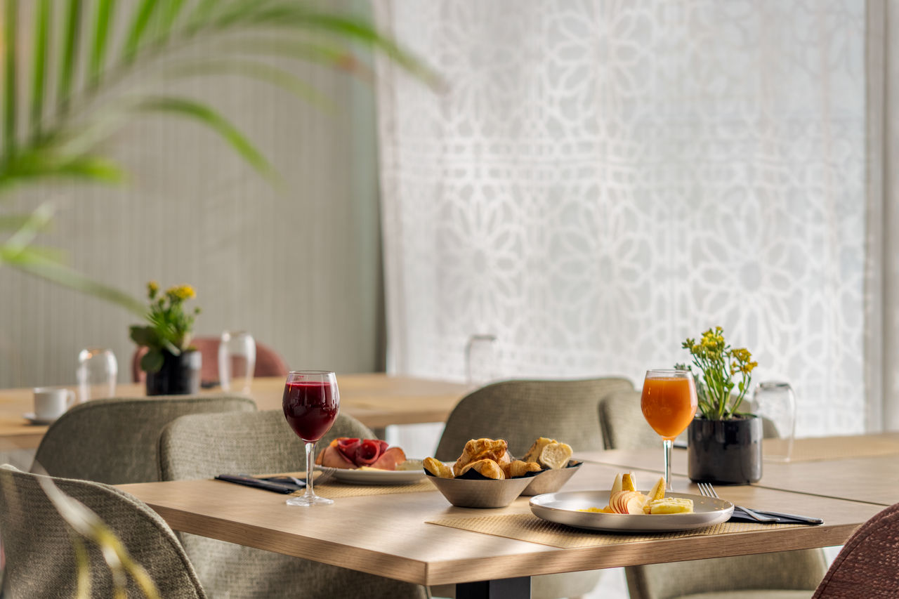 The Algarbe restaurant, at the Hotel near the Beach in Tangier, serves croissants, elegantly plated dishes, and juices