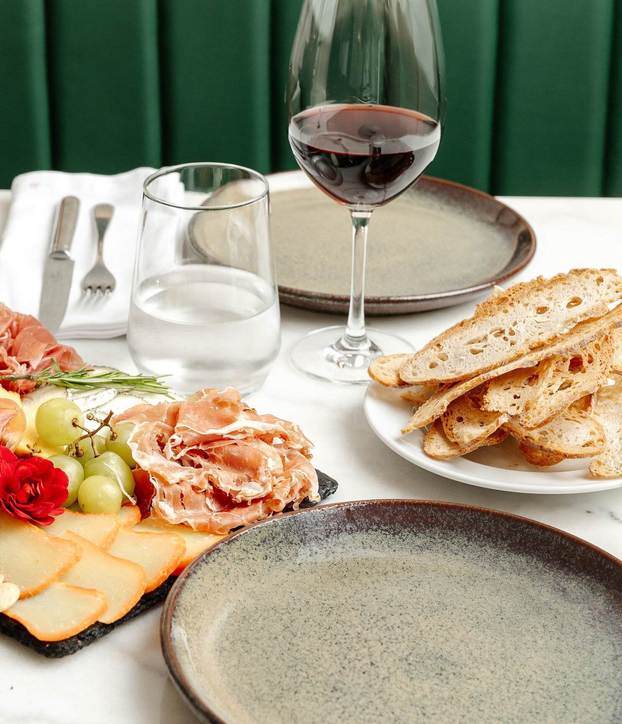 Restaurant Taberna da Praça at the 5-Star Hotel in Cascais serves charcuterie boards you may enjoy with wine
