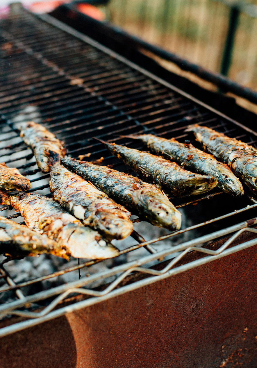 Sardines on a grill the traditional fish that accompanies the popular festivities in June in Lisbon