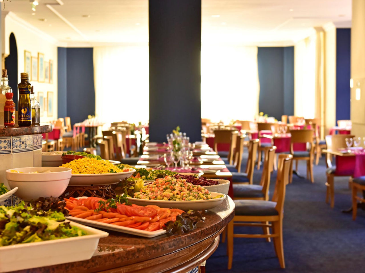 The restaurant A Vila, at the Hotel de Charme in Madeira has breakfast with a fruit buffet and tables