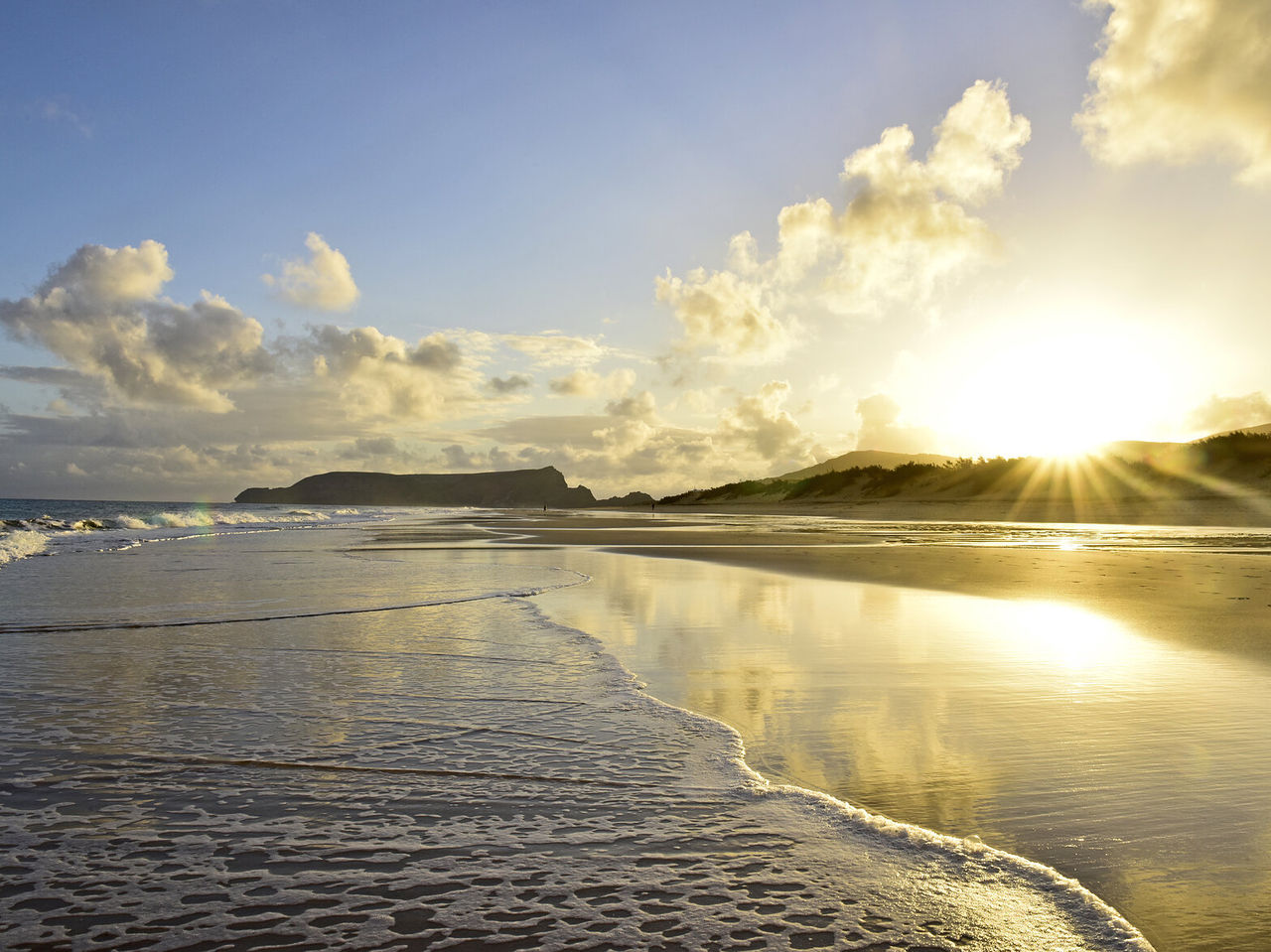 Sunset by the sea, over a calm sea typical of the beaches of Porto Santo